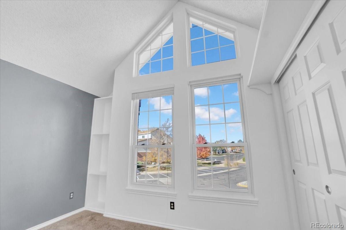 3066 West Prentice Avenue, Unit G Littleton, CO 80123 - Photo 17 of 18 a view of a hallway to room with wooden floor