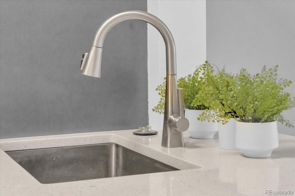 3066 West Prentice Avenue, Unit G Littleton, CO 80123 - Photo 5 of 18 a white tub with a potted plant