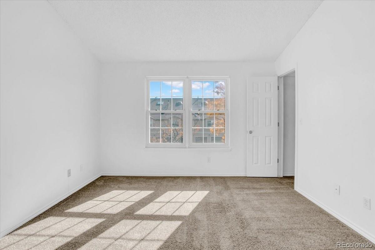 3066 West Prentice Avenue, Unit G Littleton, CO 80123 - Photo 10 of 18 an empty room with windows