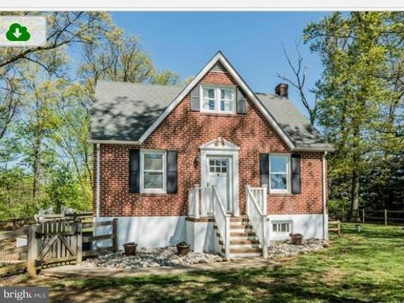 15103 Parrish Road Upperco, MD 21155 - Photo 2 of 26 a front view of a house with a yard