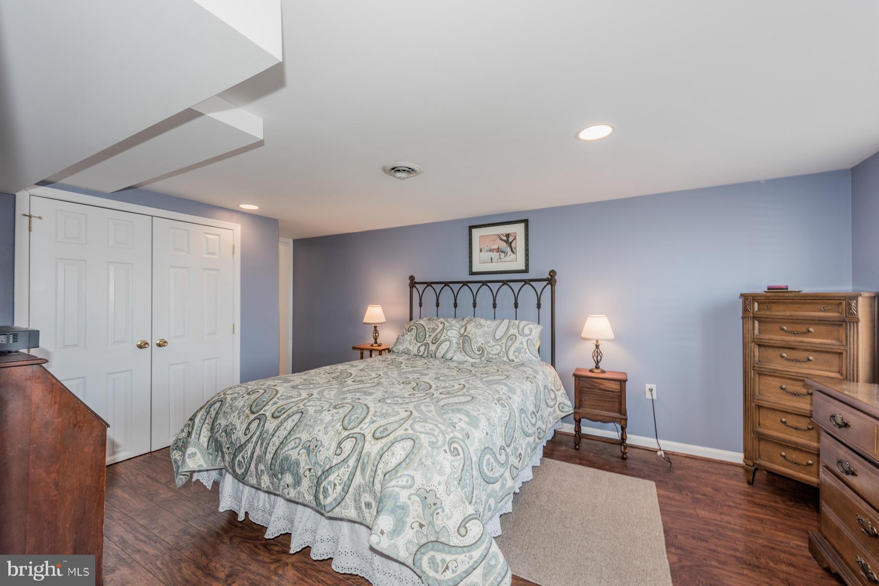 15103 Parrish Road Upperco, MD 21155 - Photo 12 of 26 a bedroom with a bed and a dresser