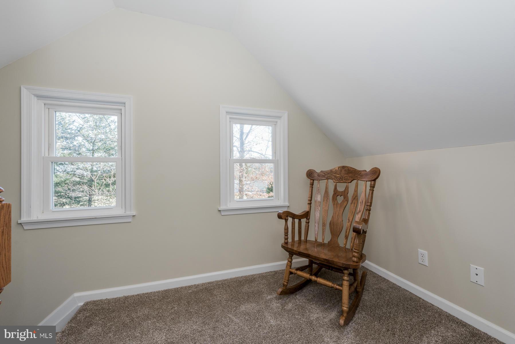 15103 Parrish Road Upperco, MD 21155 - Photo 15 of 26 a room that has a bed and chair