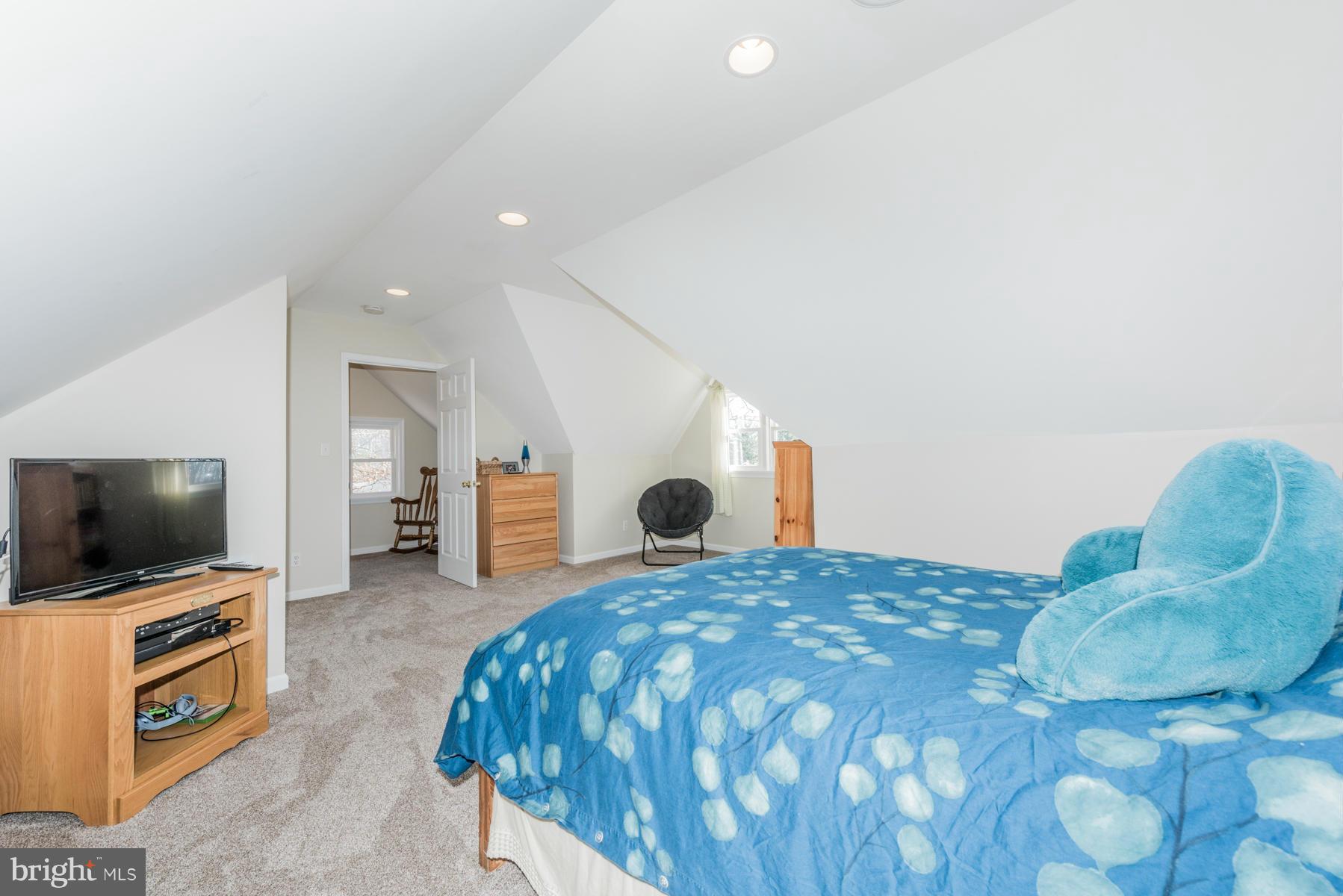 15103 Parrish Road Upperco, MD 21155 - Photo 18 of 26 a bedroom with a bed and a flat screen tv