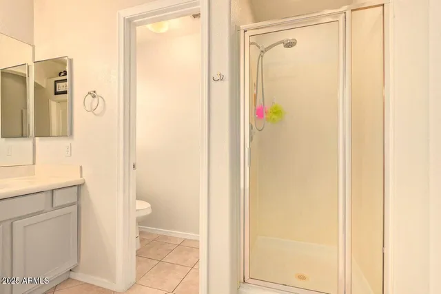 a bathroom with a shower and a sink