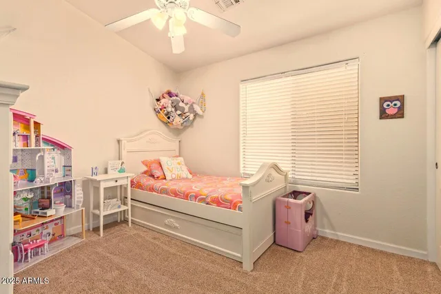 a bedroom with furniture and a window