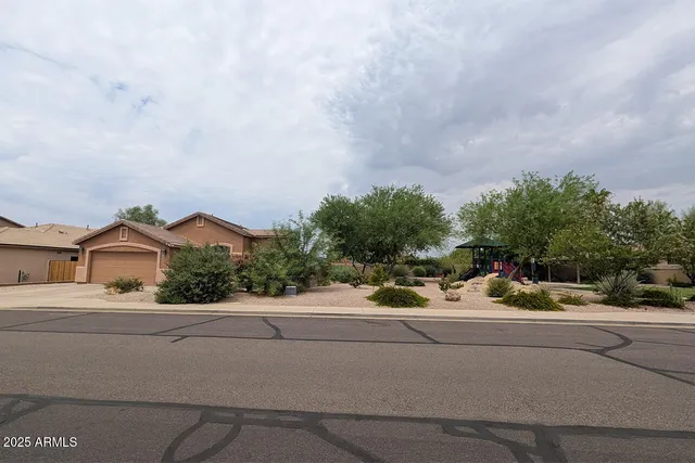 a view of a street with a car parked side of the road