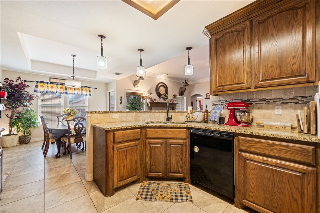 2602 Retta Drive Corpus Christi, TX 78418 - Photo 14 of 32 a kitchen with a sink and cabinets
