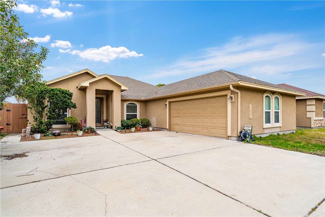 2602 Retta Drive Corpus Christi, TX 78418 - Photo 2 of 32 a front view of a house with yard