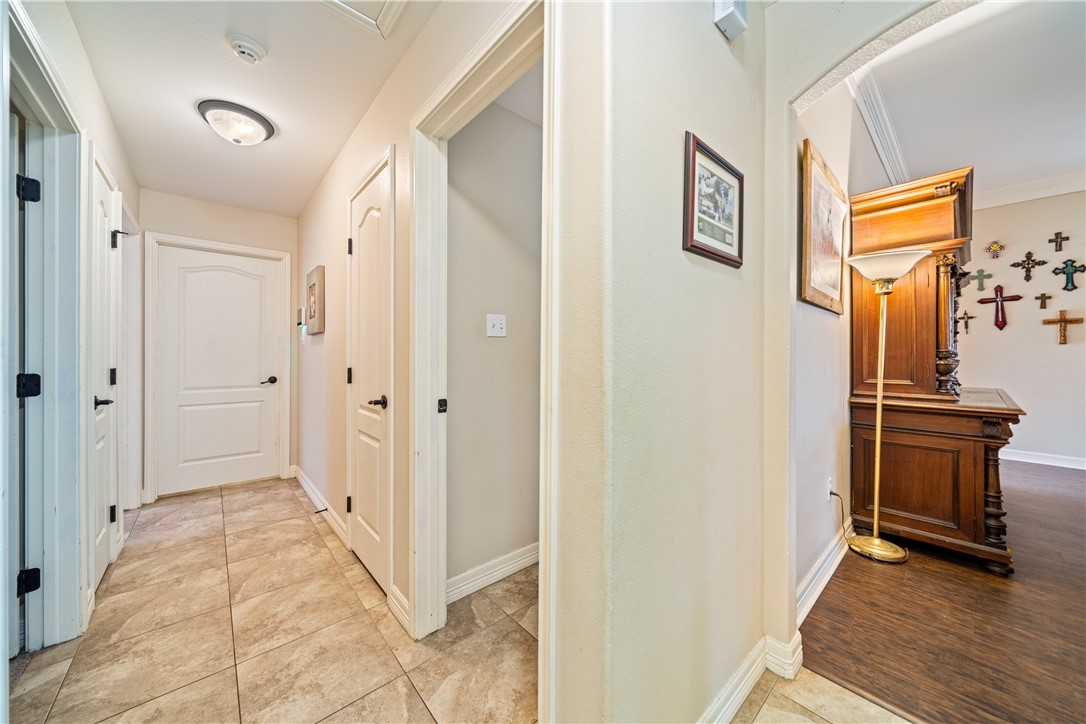 2602 Retta Drive Corpus Christi, TX 78418 - Photo 22 of 32 a view of a hallway with wooden floor