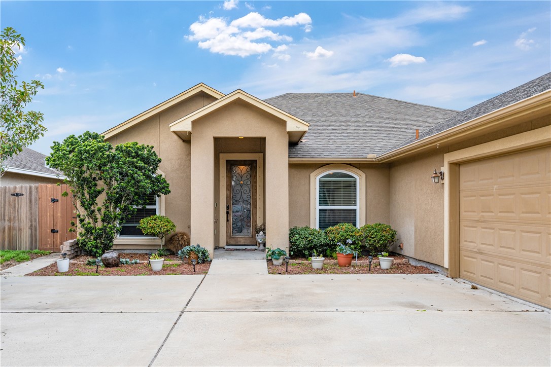 2602 Retta Drive Corpus Christi, TX 78418 - Photo 3 of 32 a front view of a house with garden