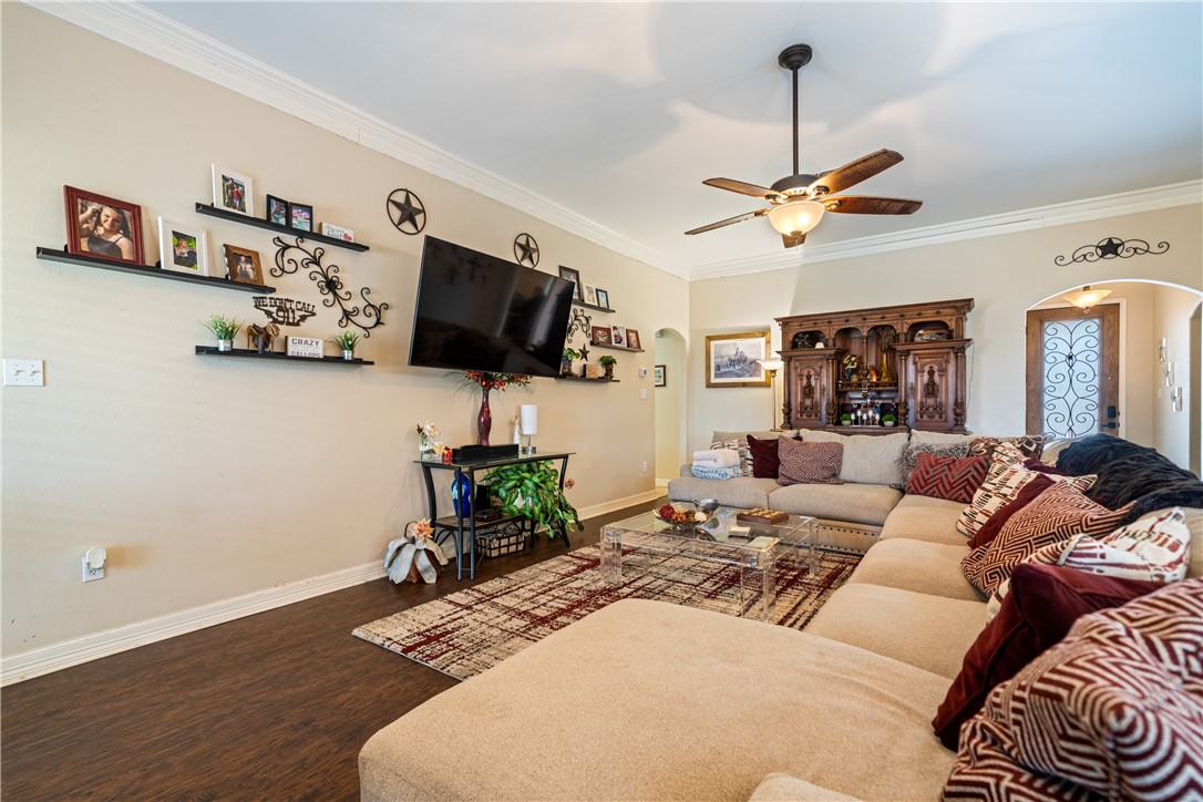 2602 Retta Drive Corpus Christi, TX 78418 - Photo 8 of 32 a living room with furniture a flat screen tv and a window
