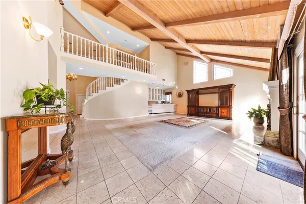 a bedroom with a bed chair and a window