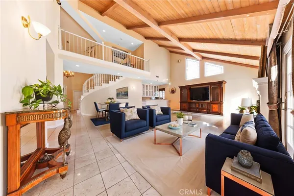 a living room with furniture fireplace and a flat screen tv