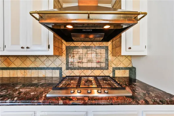 a spacious bathroom with a tub sink and mirror