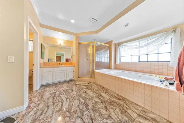 a spacious bathroom with a granite countertop sink and a mirror