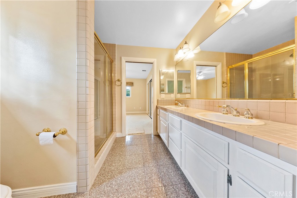 2 Linda Rae Way Arcadia, CA 91006 - Photo 45 of 63 a spacious bathroom with a granite countertop sink and a mirror