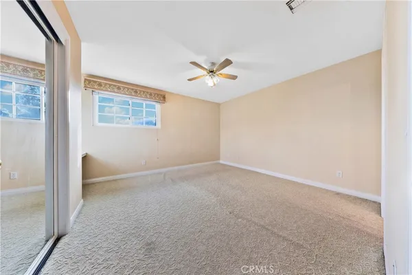 an aerial view of a swimming pool with outdoor seating and plants