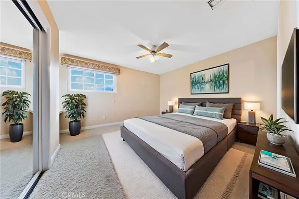 an aerial view of a houses and a swimming pool