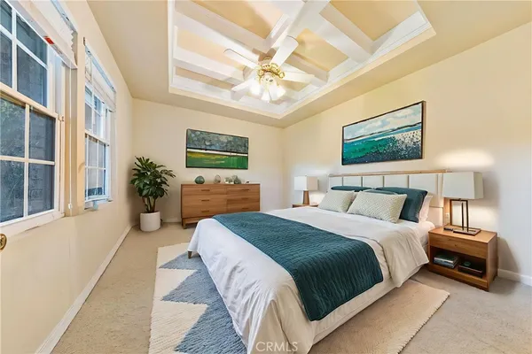 an aerial view of a house with a yard and potted plants