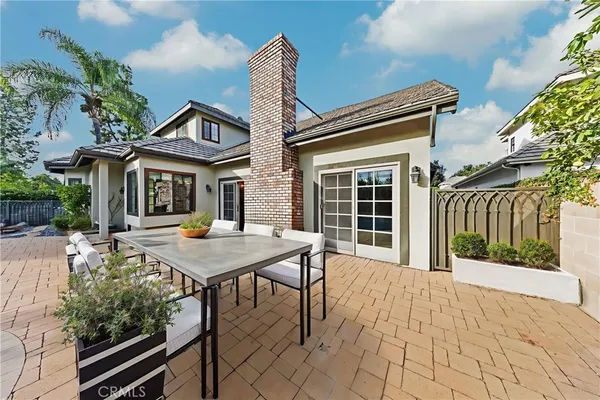 a view of an empty room with window and a fireplace