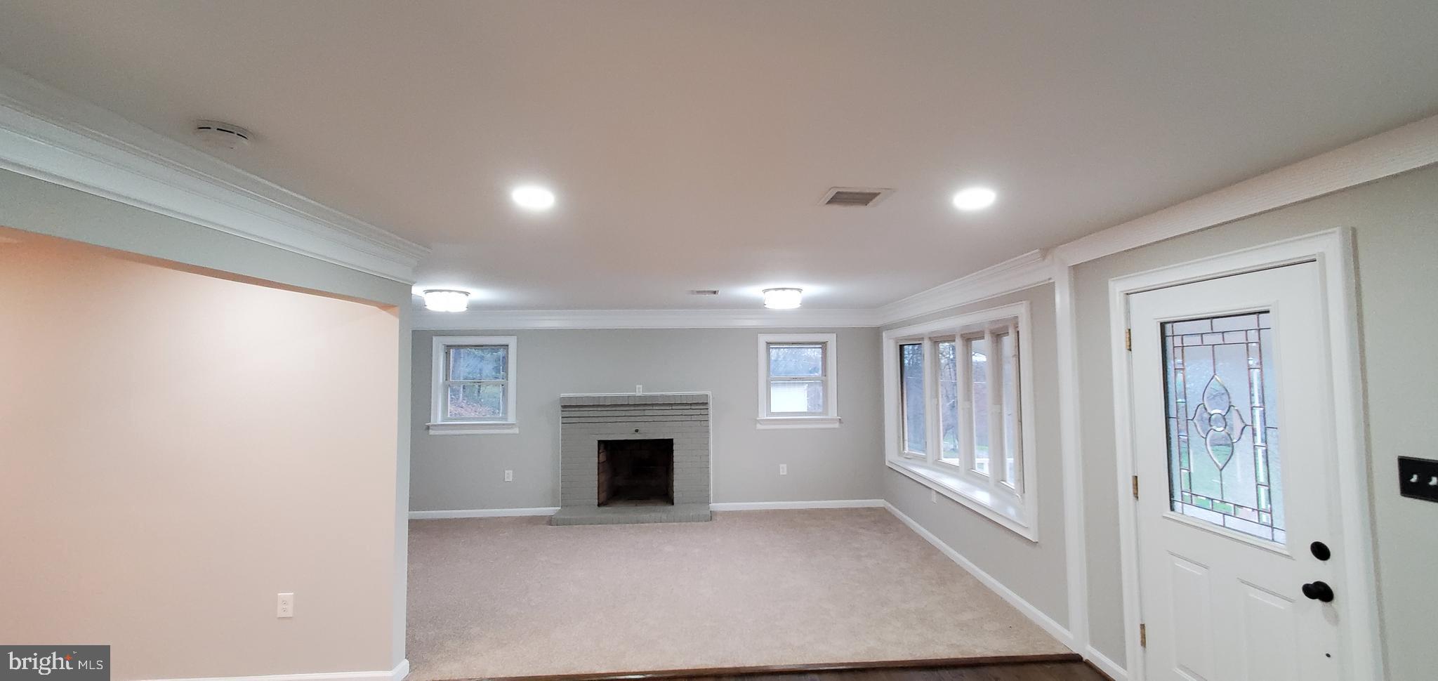 7641 Dollyhyde Road Mount Airy, MD 21771 - Photo 10 of 31 a view of an empty room with a fireplace and a window