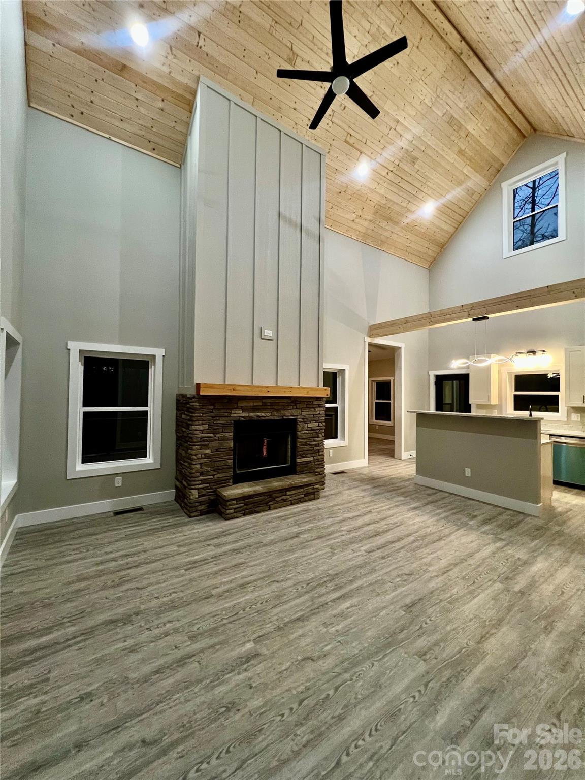 199 Clinchfield Gap Road Marion, NC 28752 - Photo 12 of 29 a view of empty room with wooden floor and fireplace