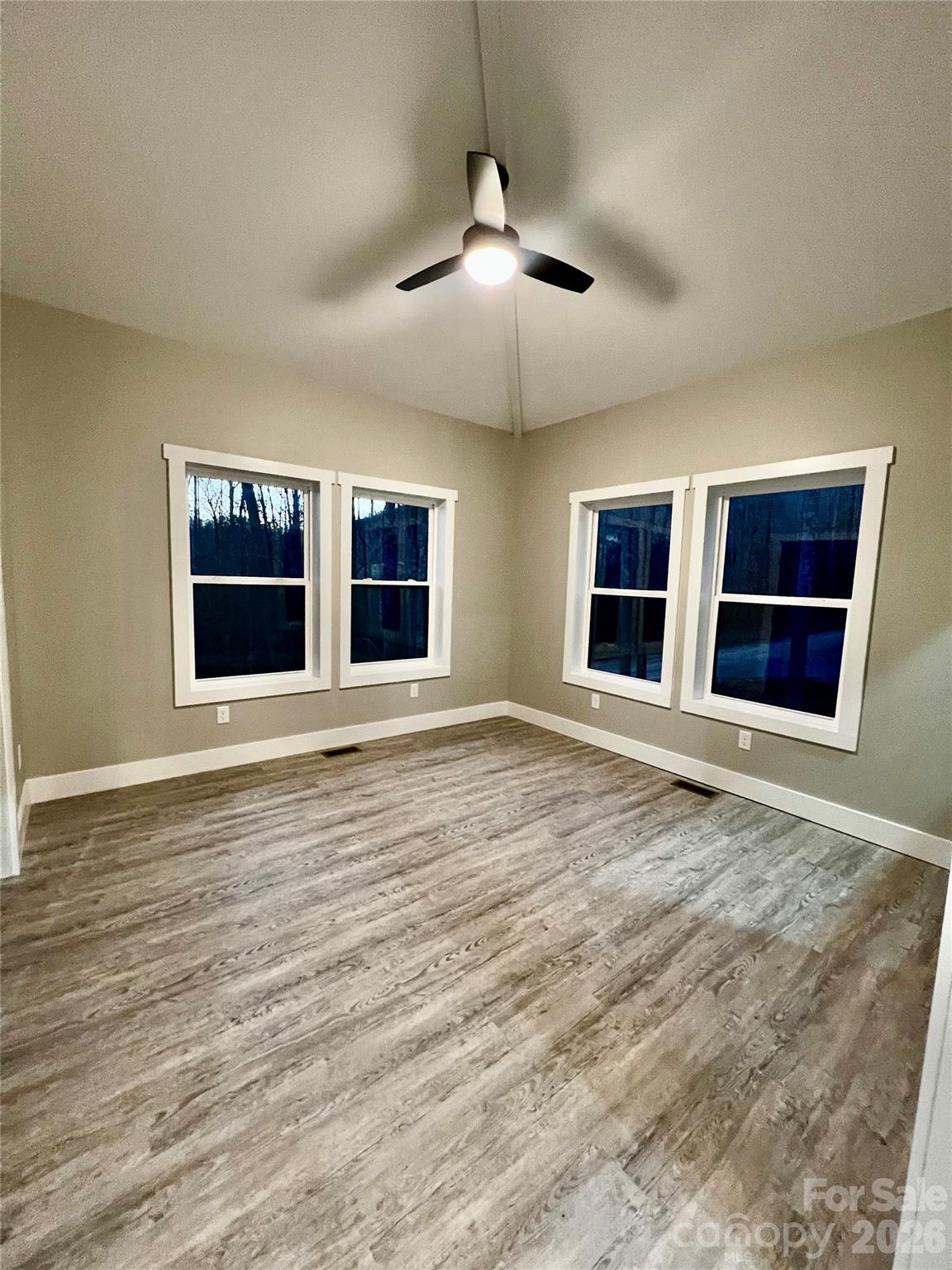 199 Clinchfield Gap Road Marion, NC 28752 - Photo 16 of 29 a view of an empty room with window and cabinet area