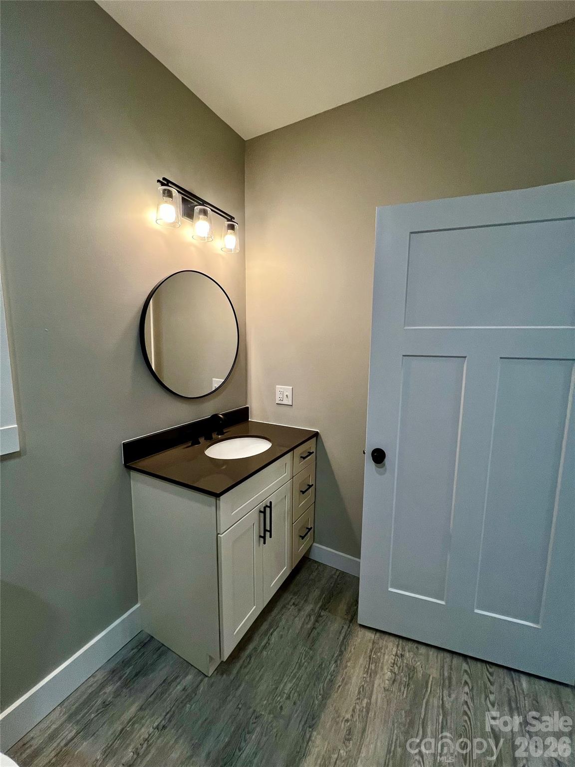 199 Clinchfield Gap Road Marion, NC 28752 - Photo 17 of 29 a kitchen with granite countertop a stove a sink and a mirror