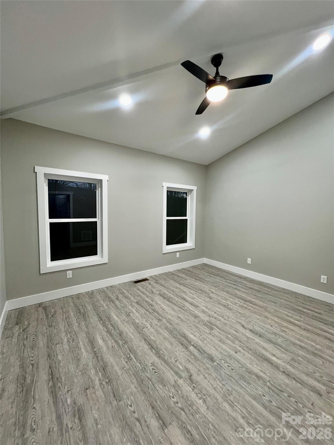 199 Clinchfield Gap Road Marion, NC 28752 - Photo 19 of 29 a view of an empty room with a window and wooden floor