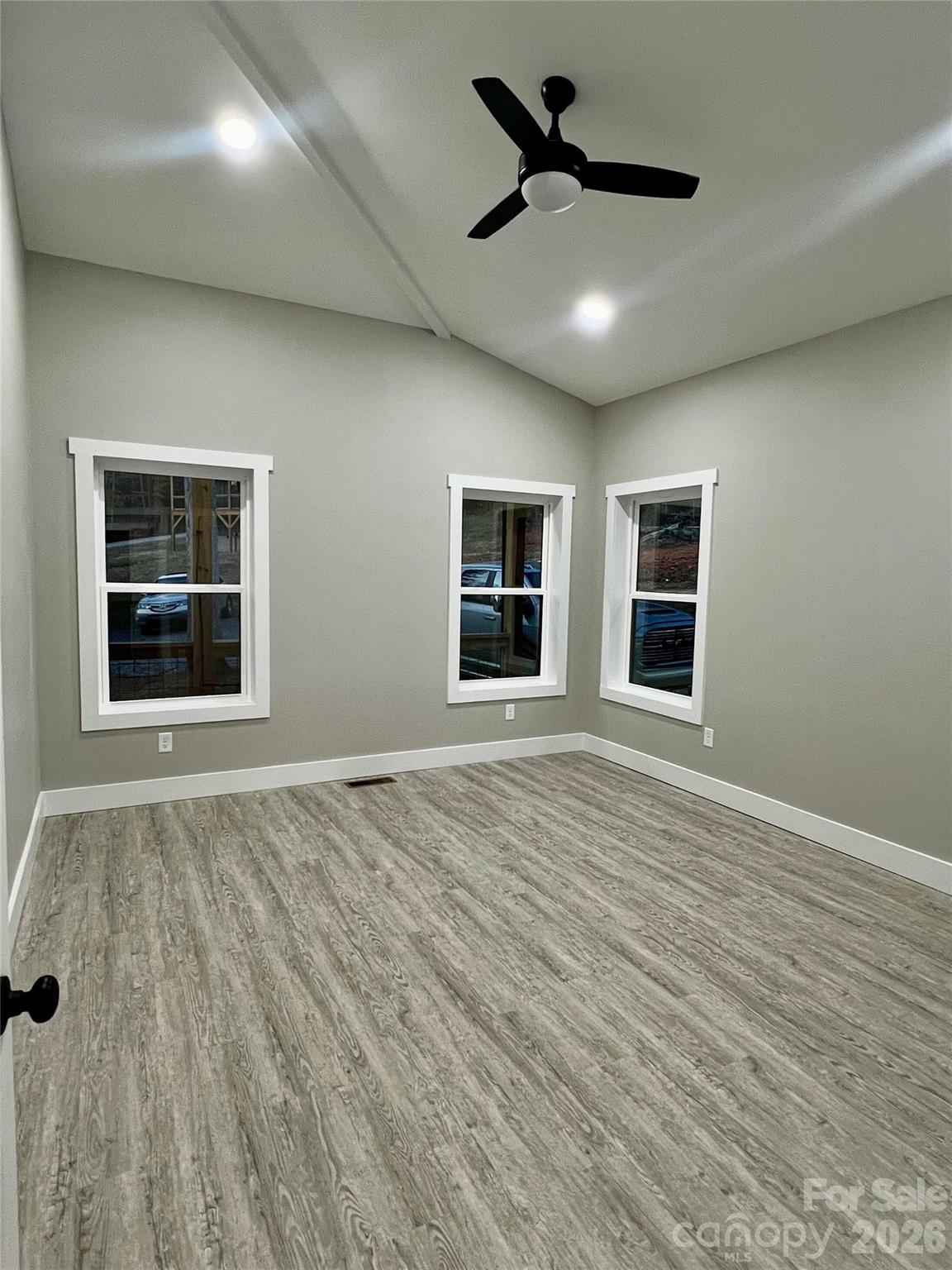 199 Clinchfield Gap Road Marion, NC 28752 - Photo 25 of 29 a view of empty room with wooden floor and fan