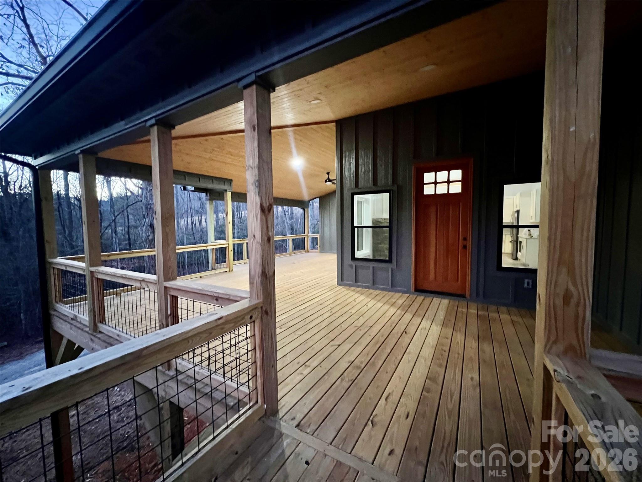 199 Clinchfield Gap Road Marion, NC 28752 - Photo 4 of 29 a view of balcony with floor to ceiling windows with wooden floor