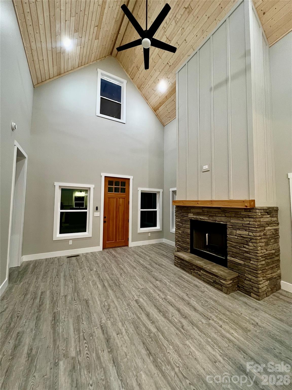 199 Clinchfield Gap Road Marion, NC 28752 - Photo 5 of 29 a view of a livingroom with a fireplace and window