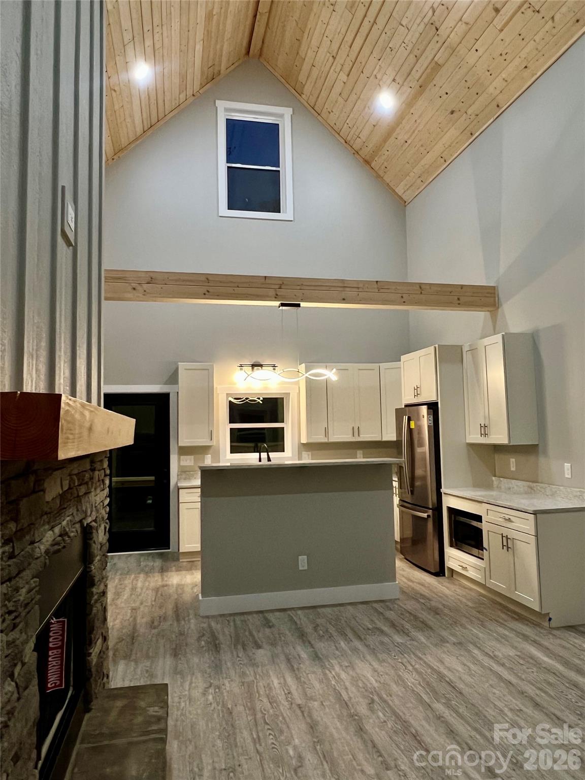 199 Clinchfield Gap Road Marion, NC 28752 - Photo 6 of 29 a kitchen with stainless steel appliances granite countertop a refrigerator and a stove top oven