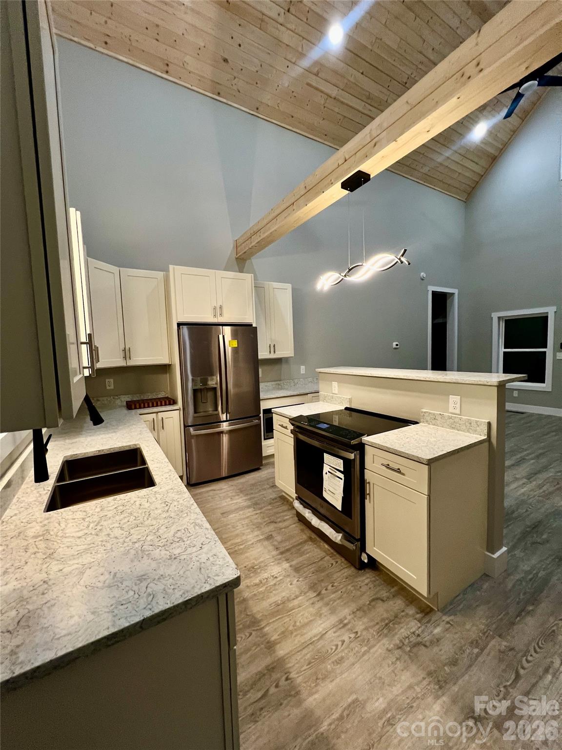 199 Clinchfield Gap Road Marion, NC 28752 - Photo 9 of 29 a kitchen with stainless steel appliances granite countertop a sink and a stove