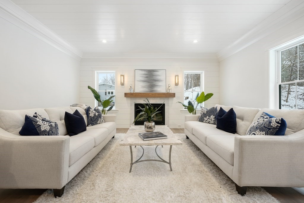 15 Peterson Road Natick, MA 01760 - Photo 1 of 27 a living room with furniture and a fireplace