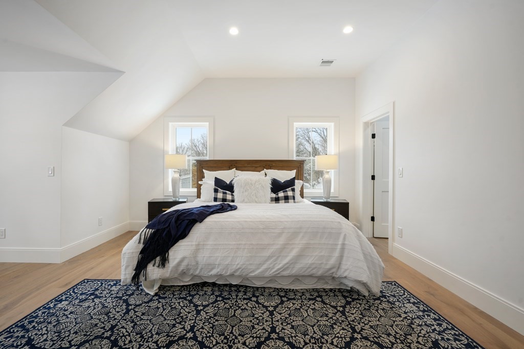 15 Peterson Road Natick, MA 01760 - Photo 18 of 27 a bedroom with a bed and wooden floor