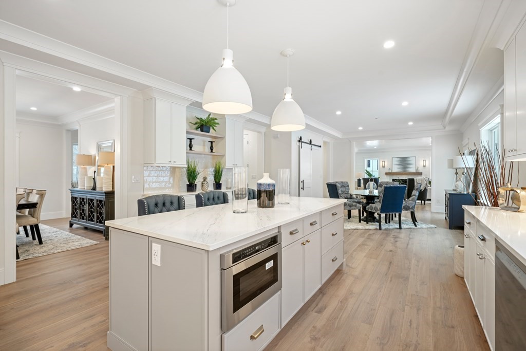 15 Peterson Road Natick, MA 01760 - Photo 5 of 27 a large kitchen with a large counter top appliances and wooden floor