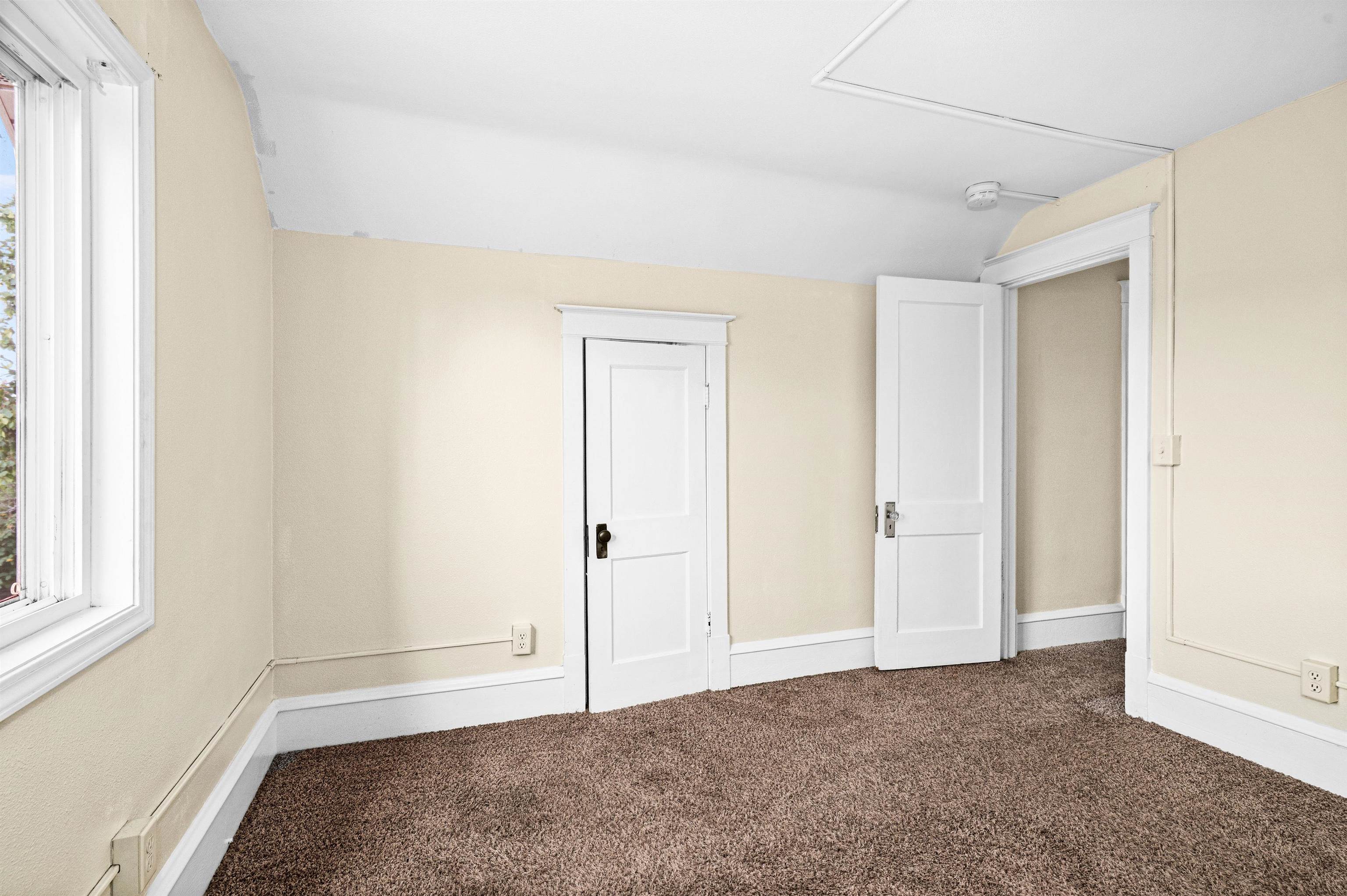4022 East 2nd Street Superior, WI 54880 - Photo 15 of 30 Unfurnished bedroom featuring carpet floors and vaulted ceiling
