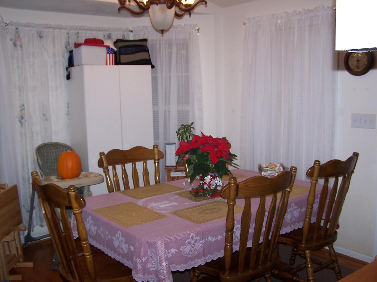 1334 Thomasson Mill Road Goodview, VA 24095 - Photo 5 of 7 a view of a dining room with furniture and wooden floor