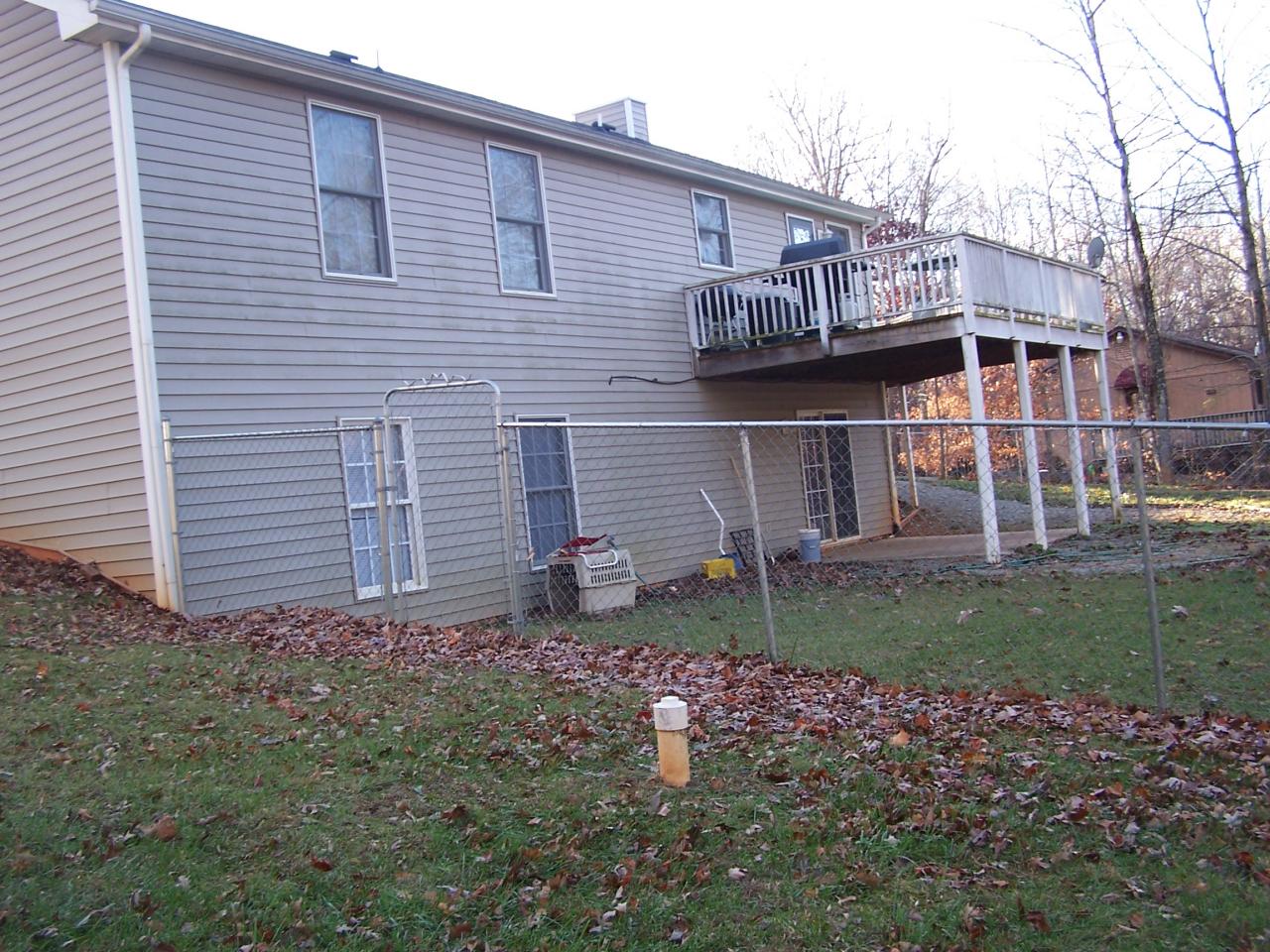 1334 Thomasson Mill Road Goodview, VA 24095 - Photo 7 of 7 a view of a house with a yard