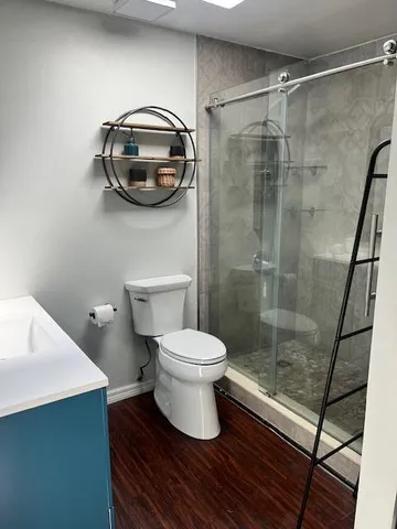 a bathroom with a toilet and a sink