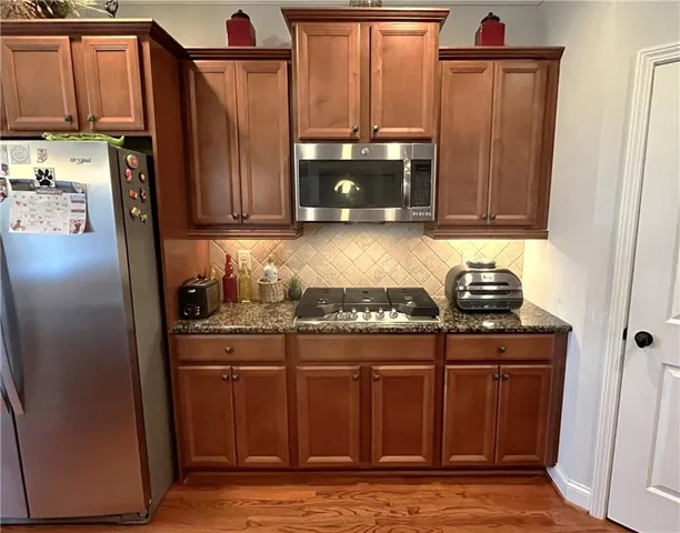 a bathroom with a sink toilet and a mirror