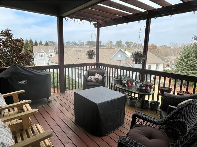 a view of a hallway view with wooden floor and staircase