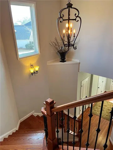 a bedroom with two beds and dresser