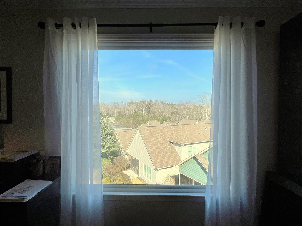 307 Cornerstone Trace Woodstock, GA 30188 - Photo 24 of 43 a view of a glass door with a chair