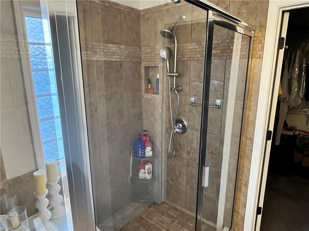 307 Cornerstone Trace Woodstock, GA 30188 - Photo 25 of 43 a bathroom with a shower and a sink