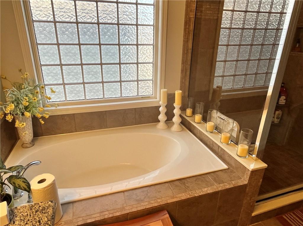 307 Cornerstone Trace Woodstock, GA 30188 - Photo 26 of 43 a bath tub sitting next to a window