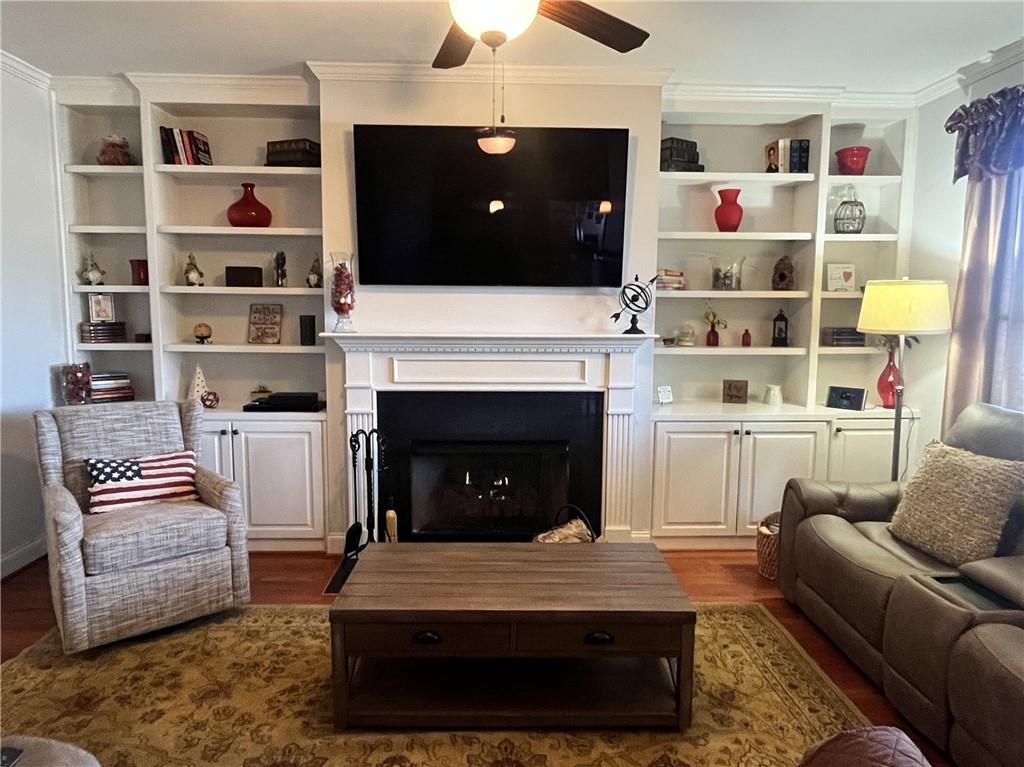 307 Cornerstone Trace Woodstock, GA 30188 - Photo 4 of 43 a living room with furniture and a fireplace