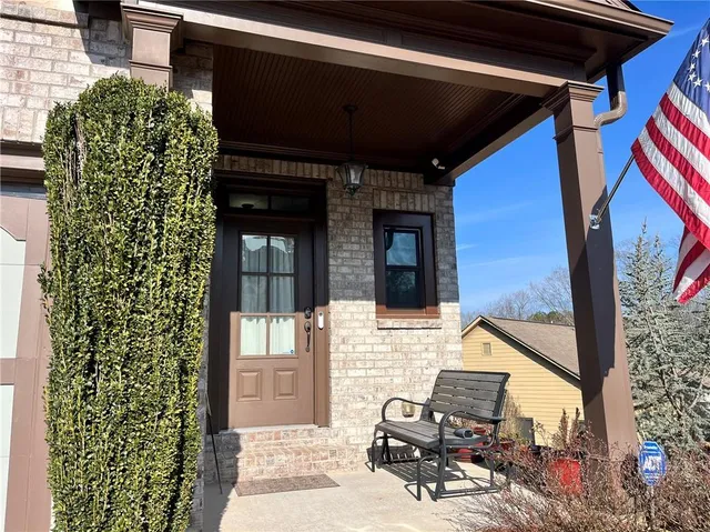 a kitchen with stainless steel appliances granite countertop a refrigerator and a stove