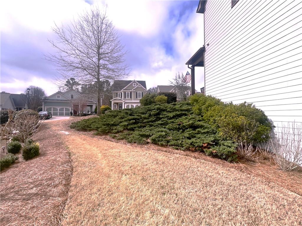 307 Cornerstone Trace Woodstock, GA 30188 - Photo 42 of 43 a view of a yard with plants and a trees
